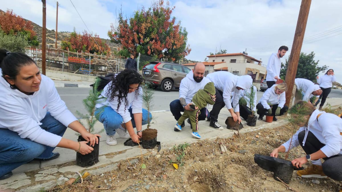 Deriv employees planting trees as part of the reforestation csr project