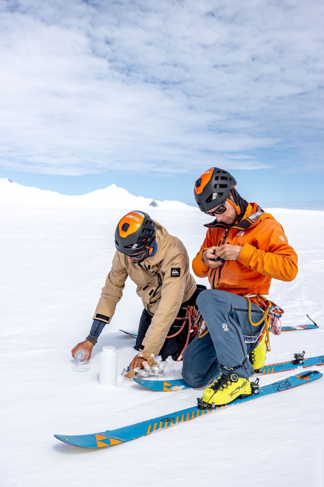 Two explorers collecting snow samples as part of the Kahuna expedition.